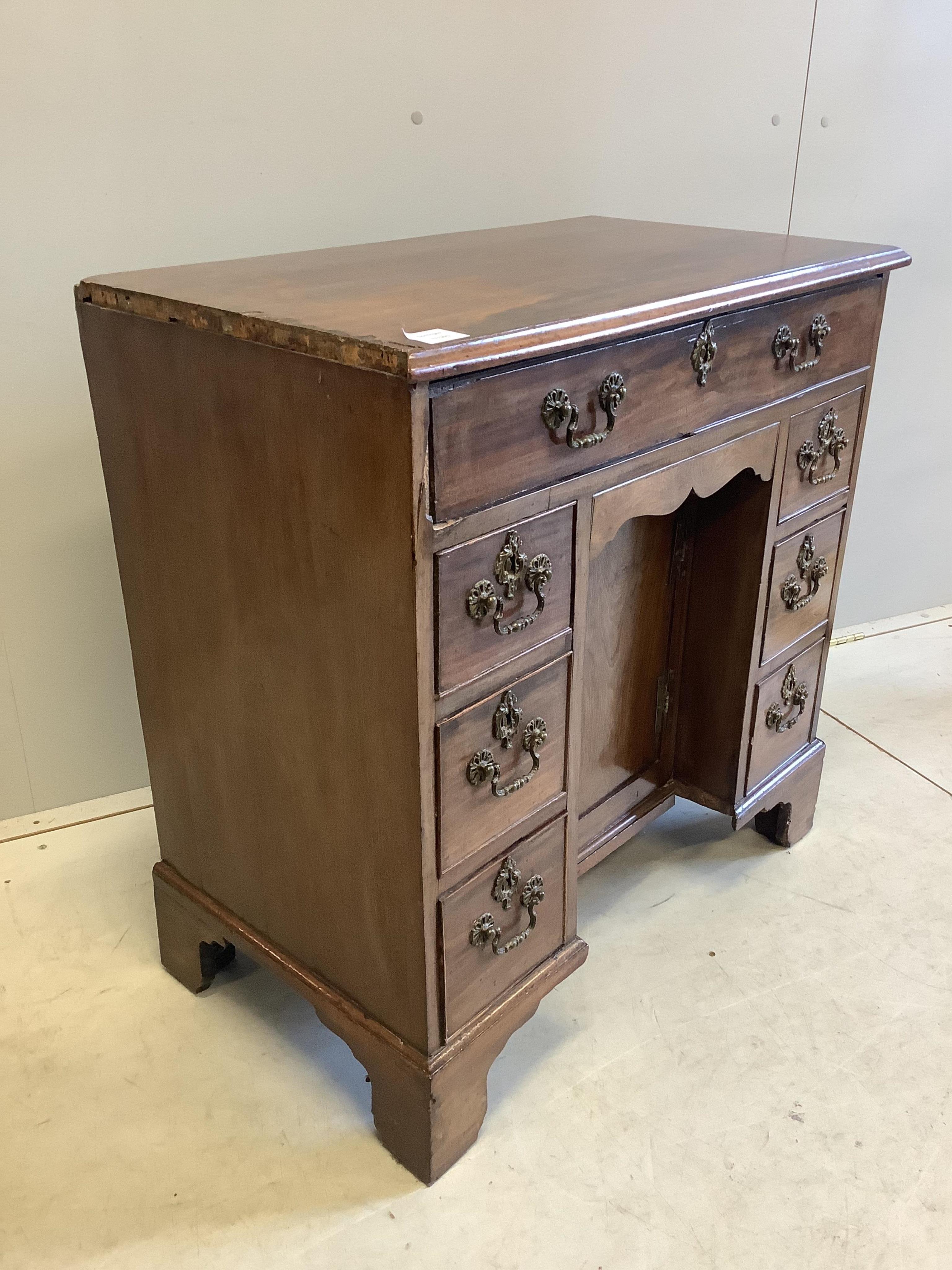 A George III mahogany kneehole desk, width 78cm, depth 43cm, height 78cm. Condition - poor